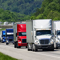 semi trucks on highway for 4th of July holiday